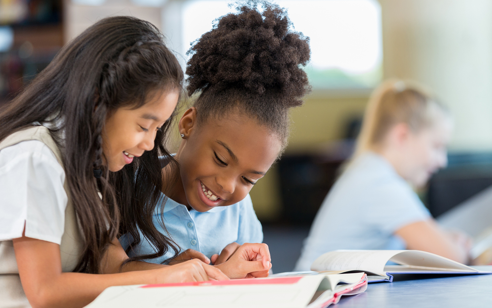 two little girls reading