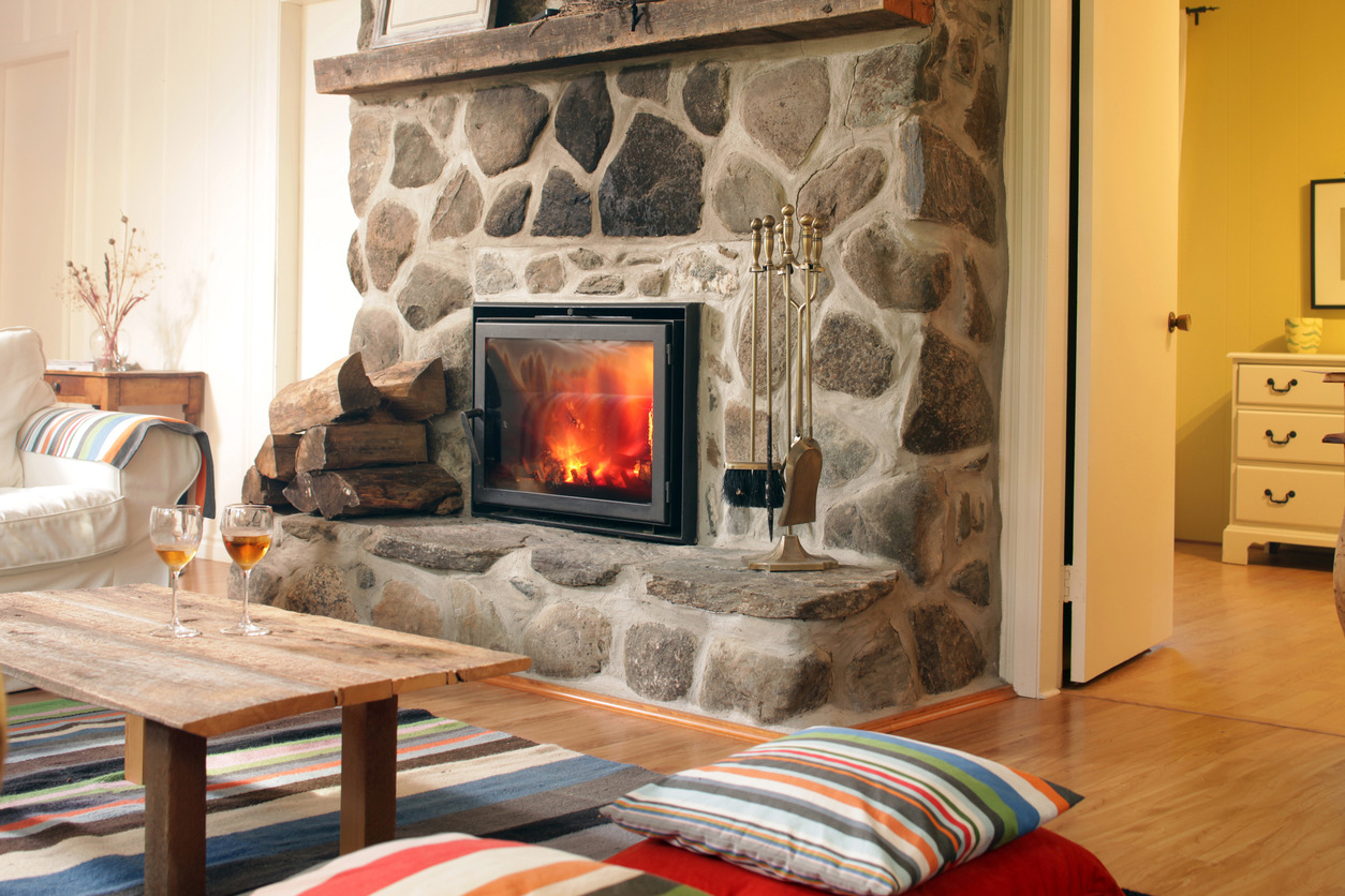 Close up of a fireplace in a cozy living room